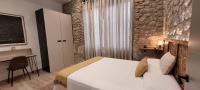 Postel nebo postele na pokoji v ubytování SUITE HAUS BAHIA