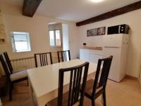 a kitchen and dining room with a table and chairs at LE BLANC, AGREABLE MAISON DE CENTRE VILLE in Le Blanc