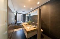 a bathroom with a sink and a mirror at Tai-Yi Red Maple Resort in Puli