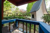 a porch with a blue railing and a bird house at Tai-Yi Red Maple Resort in Puli