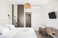 Posteľ alebo postele v izbe v ubytovaní Manthos Beachfront Apartments