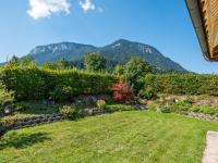 a view of a garden with mountains in the background at Obinghof in Söll