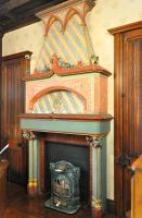 an ornate fireplace in a living room at Grand Hôtel Des Templiers in Reims
