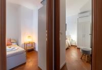 Posteľ alebo postele v izbe v ubytovaní Tiberina Rooftop Trastevere