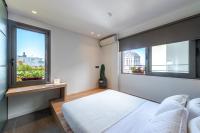 Postel nebo postele na pokoji v ubytování Hidesign Athens Acropolis Panorama Suite