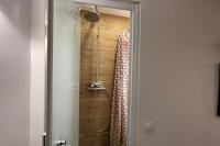 a shower with a shower curtain in a bathroom at Lovely love nest near Paris in Clichy
