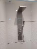 a shower in a bathroom with a phone in the wall at Maison calme&#47;Chambre privée&#47;Clim+TV&#47;Pétit dejeuner inclu&#47;tout confort in Nevers