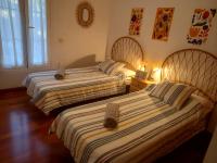 Piso Centrico 1.5km Playa con gran terraza +vistasにあるベッド