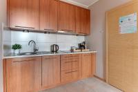 Kuchyňa alebo kuchynka v ubytovaní Flatbook - City Center SPA Apartments Toruńska