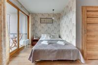 Posteľ alebo postele v izbe v ubytovaní Flatbook - City Center SPA Apartments Toruńska