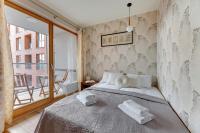 Posteľ alebo postele v izbe v ubytovaní Flatbook - City Center SPA Apartments Toruńska