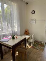 a room with a desk and a table and a chair at Guest house Shulc in Mizhhirya