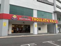 a restaurant with a red sign on the front of a building at Corner KL Pool View RC Residence with High Internet Speed 500Mbps in Kuala Lumpur