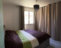 a bedroom with a bed and a window with curtains at Maison de 3 chambres a Valras Plage a 600 m de la plage avec spa jardin clos et wifi in Valras-Plage