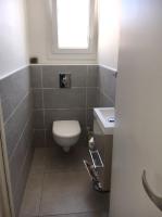 a bathroom with a toilet and a sink at Maison de 3 chambres a Valras Plage a 600 m de la plage avec spa jardin clos et wifi in Valras-Plage