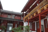 a red building with a door in front of it at Shaoxing Laotaimen Luxun Native Place Youth Hostel in Shaoxing