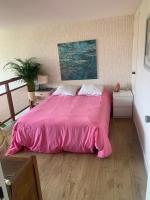 Llit o llits en una habitaci&oacute; de Appartement proche plage