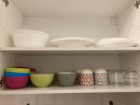 a shelf with bowls and plates and other dishes at Superb Air-conditioned studio Paris expositions porte de Versailles - Dôme de Paris - JO Olympic Games 2024 Paris Arena Sud 1-4-6 in Vanves