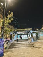 a group of people walking down some stairs at night at Main Inn Taipei in Taipei