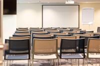 a lecture room with chairs and a whiteboard at Hotel Lille Euralille - Hilton Affiliate Hotel in Lille