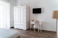 Televízia a/alebo spoločenská miestnosť v ubytovaní Residence Le Vie del Centro