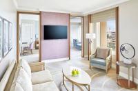 a living room with a couch and a tv at The Ritz-Carlton, Sarasota in Sarasota