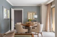 a dining room with a table and chairs at The Ritz-Carlton, Sarasota in Sarasota