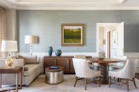 a living room with a couch and a table at The Ritz-Carlton, Sarasota in Sarasota