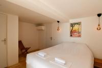 En eller flere senge i et v&aelig;relse p&aring; Villa Palm Springs Superb Sea View, Terrasse and Swimming Pool