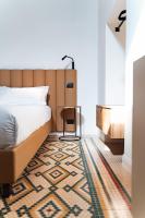 Łóżko lub łóżka w pokoju w obiekcie Le Vie Del Centro Luxury Room