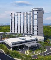 una vista aérea de un edificio con una carretera delante en Hyatt Place Huangshan Train Station, en Huangshan
