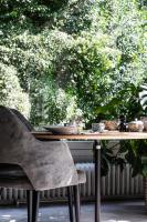 a table with a chair in front of a window at de Lochemse Berg in Barchem