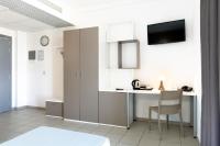 Televízia a/alebo spoločenská miestnosť v ubytovaní Hotel Campus Sanpaolo