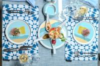 a table with plates of food on a blue and white table cloth at Casa Blue Resort in Marsa Alam City