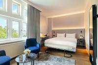 Postel nebo postele na pokoji v ubytování NH Amsterdam Leidseplein