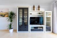 Televízia a/alebo spoločenská miestnosť v ubytovaní Neptuno Malaga Apartamento de Lujo