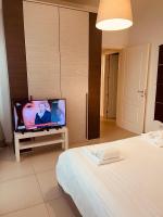 A television and/or entertainment centre at Berga Exclusive Suite 5