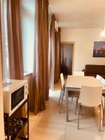 A television and/or entertainment centre at Berga Exclusive Suite 5