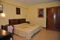 Łóżko lub łóżka w pokoju w obiekcie Hotel Tortorina