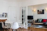 a living room with a white table and chairs at Beautiful &amp; Bright Apartment Near Pigalle in Paris