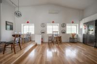 a large living room with a table and chairs at Light Hostel in Chiayi City