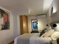Postel nebo postele na pokoji v ubytování Apartamentos Ciudad Santiago