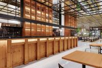 a restaurant with wooden walls and tables and benches at Hotel Aubamar Suites & Spa in Playa de Palma