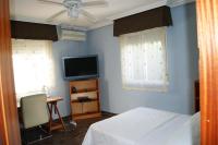 A television and/or entertainment centre at Villa Coco