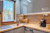 Kuchyň nebo kuchyňský kout v ubytování Luxury Flat in Grand Resort Pamporovo by Flat Mаnager
