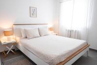 Posteľ alebo postele v izbe v ubytovaní New cosy apartments with private parking