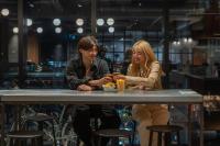 two people sitting at a table in a restaurant at The Millennials Kyoto in Kyoto