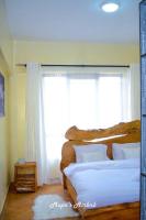 Mupa's Luxury Condo IIにあるベッド