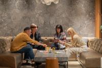 a group of people sitting on a couch at The Millennials Kyoto in Kyoto