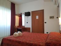 A bed or beds in a room at Hotel Della Volta